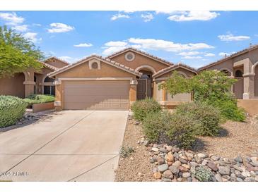 Inviting single-story home with a desert-landscaped front yard and two car garage at 10226 E Pine Valley Rd, Scottsdale, AZ 85255