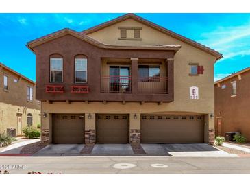 Inviting two-story townhome featuring a private balcony and three-car garage at 2250 E Deer Valley Rd # 26, Phoenix, AZ 85024