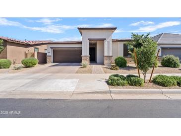 Charming single-story home featuring a manicured front yard and a welcoming entrance in a suburban neighborhood at 22938 E Calle Luna --, Queen Creek, AZ 85142
