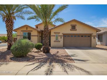 Inviting single-story home featuring desert landscaping and a two-car garage with a neutral color scheme at 5312 S 33Rd Ave, Phoenix, AZ 85041