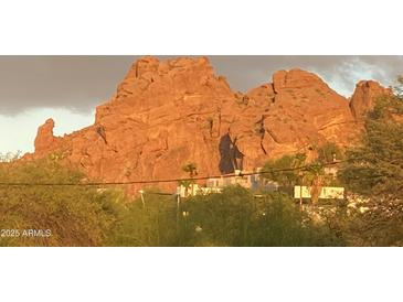 Scenic view of Camelback Mountain with lush desert landscaping and the soft glow of sunset lighting at 5625 N 45Th St, Phoenix, AZ 85018