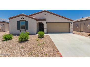 Inviting single-story home featuring a two-car garage, neutral stucco, a desert landscape, and a charming covered entry at 25539 W Gwen St, Buckeye, AZ 85326