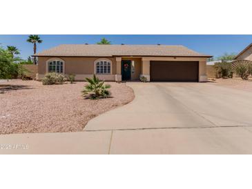 Charming single-story home with a two-car garage, desert landscaping, and a welcoming entrance at 846 N 81St St, Mesa, AZ 85207