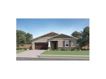 Charming single-story home features a two-car garage, desert landscaping, and a welcoming front porch at 16895 W Bronco Trl, Surprise, AZ 85387