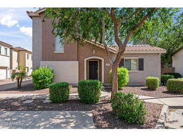 Charming two-story home with landscaped front yard and covered front porch at 4743 E Laurel Ave, Gilbert, AZ 85234