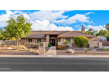 Beautiful single-story home featuring desert landscaping and a tile roof at 5861 E Anderson Dr, Scottsdale, AZ 85254