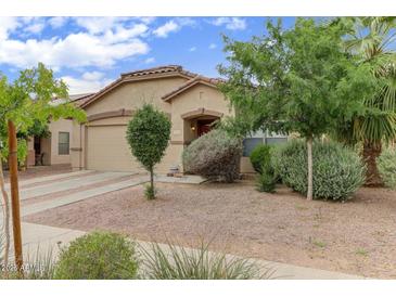 Charming single-story home featuring desert landscaping and a tile roof at 218 E Milada Dr, Phoenix, AZ 85042