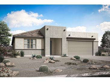 Contemporary single-story home showcasing desert landscaping and a neutral color palette at 25801 N 147Th Dr, Surprise, AZ 85387
