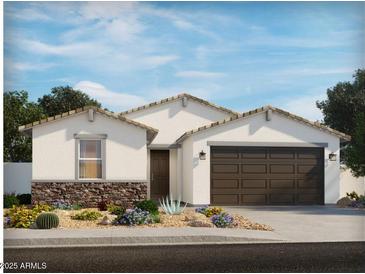 Charming single-story home featuring a brown two-car garage, stone accents, and desert landscaping at 2626 E Grenache Rd, San Tan Valley, AZ 85143