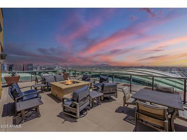 Relaxing rooftop deck showcases amazing city views, comfortable seating, and a cozy fire pit at 310 S 4Th St # 1601, Phoenix, AZ 85004