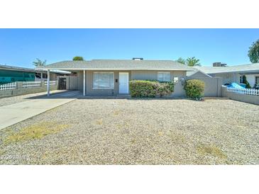 Charming single-story home featuring a covered carport, low-maintenance landscaping, and a classic facade at 3107 W Lisbon Ln, Phoenix, AZ 85053