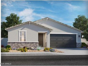 Charming single-story home with a two-car garage, neutral paint, and low maintenance desert landscaping at 31339 N Pinot Dr, San Tan Valley, AZ 85143