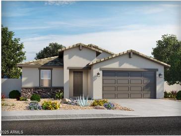 Charming single-story home showcasing desert landscaping and a two-car garage at 31365 N Pinot Dr, San Tan Valley, AZ 85143
