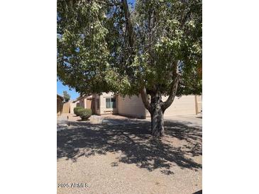 Charming single-story home with a well-maintained front yard landscape, and spacious driveway at 40047 N Cassara Dr, San Tan Valley, AZ 85140