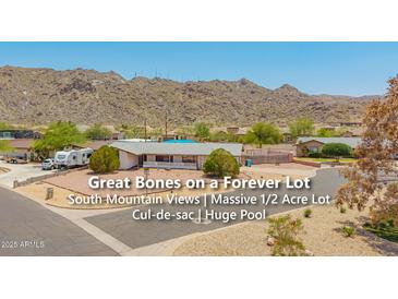 Inviting single-story home on a large lot boasting a pool and mountain views at 405 E Thunderbird Trl, Phoenix, AZ 85042