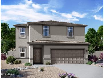 Charming two-story home featuring neutral-toned stucco and a neatly landscaped front yard at 47204 W Coe St, Maricopa, AZ 85139