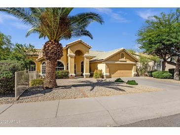 Charming single-story home with a well-maintained front yard and covered entry at 16002 E Gleneagle Dr, Fountain Hills, AZ 85268