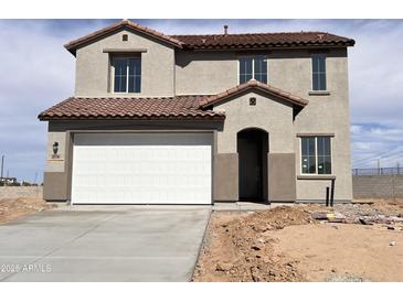 Charming two-story home featuring a two-car garage, tile roof, and neutral-toned stucco exterior at 20756 N 224Th Ave, Surprise, AZ 85387