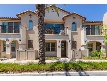 Charming two-story townhome featuring stucco siding, a balcony, and a private entrance at 4711 S Vapor --, Mesa, AZ 85212