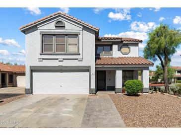 Charming two-story home with a well-maintained front yard and two car garage at 7500 E Deer Valley Rd # 54, Scottsdale, AZ 85255