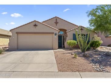 Charming single-story home featuring a two-car garage and desert landscaping for low maintenance living at 10333 E Gold Nugget Ct, Gold Canyon, AZ 85118