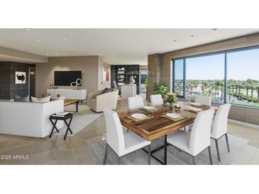Bright and airy living room with large windows, a modern fireplace, and a stylish dining area with seating for six at 1040 E Osborn Rd # 501, Phoenix, AZ 85014