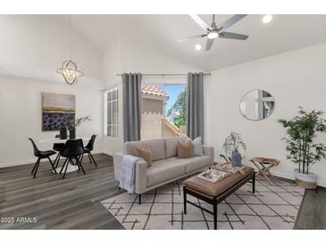 Inviting living room features vaulted ceilings, neutral tones, and ample natural light at 1633 E Lakeside Dr # 127, Gilbert, AZ 85234
