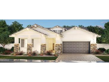 Charming single-story home with stone accents, a neutral palette, and a spacious two-car garage at 2559 E Virginia Cir, Mesa, AZ 85213