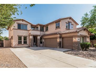 Spacious two-story home with three-car garage and neutral stucco exterior at 4507 E Lantern Pl, Gilbert, AZ 85297