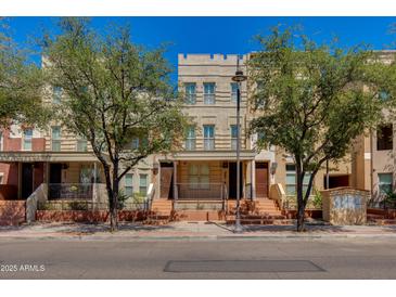 Charming townhome exterior featuring inviting front porches and neat landscaping at 581 S Roosevelt St, Tempe, AZ 85281