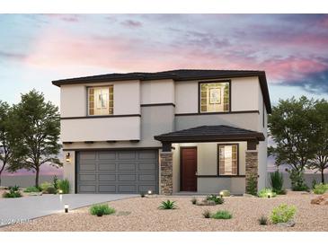 Charming two-story home featuring stone accents, a two-car garage, and desert landscaping at 19225 N Los Gabrieles Way, Maricopa, AZ 85138