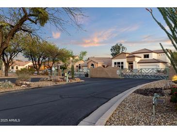 Gated community entrance with desert landscaping, and tile roofed homes at Vista Point in Scottsdale, Arizona at 9548 E Kiva Ln, Gold Canyon, AZ 85118