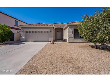 Charming single-story home featuring a low maintenance desert landscape and a two-car garage at 17844 W Caribbean Ln, Surprise, AZ 85388