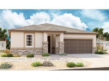 Charming single-story home showcasing a stone veneer, desert landscaping and a two-car garage at 18773 E Panchito Dr, Gold Canyon, AZ 85118