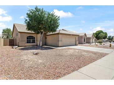 Charming single-story home with a two-car garage and mature landscaping in a residential neighborhood at 351 N Danyell Dr, Chandler, AZ 85225