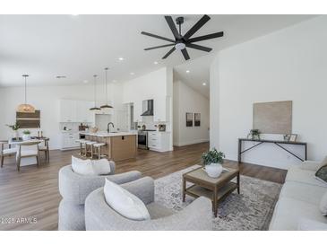 Open-concept living space with seamless flow between the kitchen and living areas at 7144 E Lakeview Ave, Mesa, AZ 85209