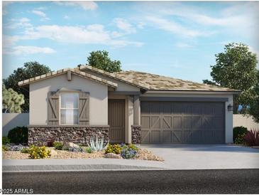 Charming single-story home featuring a stone accent wall, neutral stucco and a desert landscaped front yard at 8577 W Trenton Ct, Florence, AZ 85132