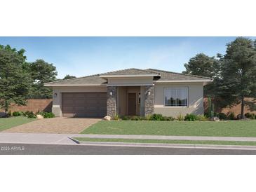 Charming single-story home with stone accents, a two-car garage and a neatly landscaped front yard at 870 W Peralta Pass, Apache Junction, AZ 85120