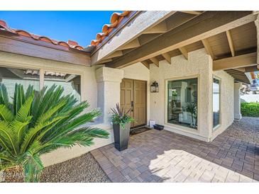 Inviting front entrance featuring a terracotta roof, double doors, and desert landscaping at 10023 E Sunnyslope Ln, Scottsdale, AZ 85258
