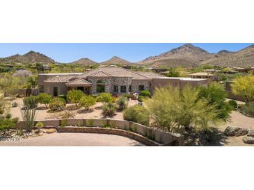 Stunning desert home boasting stone accents, mature landscaping and paver driveway at 24200 N Alma School Rd # 7, Scottsdale, AZ 85255