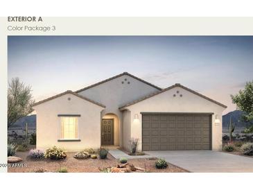 Charming single-story home featuring a neutral color scheme, desert landscaping, and a two-car garage at 25438 W Chipman Rd, Buckeye, AZ 85326