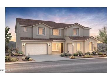 Stunning two-story home showcasing a neutral color palette, two-car garage, and well-manicured landscaping at 25845 S 227Th St, Queen Creek, AZ 85142