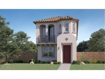 Charming home featuring a tile roof, small balcony, and inviting red front door at 3332 S Lotus Ave, Mesa, AZ 85212