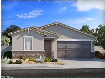 Charming single-story home featuring desert landscaping, a two-car garage, and neutral-toned exterior at 7345 E Cozy Cottage Ln, San Tan Valley, AZ 85143