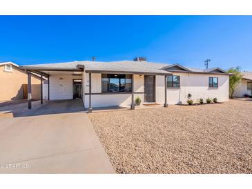 Charming single-story home featuring a well-maintained yard and a cozy, inviting entrance at 1001 W 19Th St, Tempe, AZ 85281