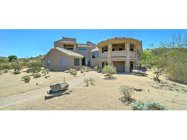 Stunning desert home featuring a unique architectural design and beautiful desert landscaping at 3903 E Melody Dr, Phoenix, AZ 85042