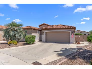 Charming single-story home with a red tile roof, desert landscaping, and a two-car garage at 4239 E Azalea Dr, Gilbert, AZ 85298