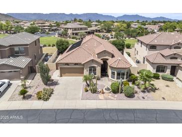 Beautiful single-Gathering home featuring desert landscaping, a fountain, and a neutral color palette at 9722 S 45Th Ave, Laveen, AZ 85339