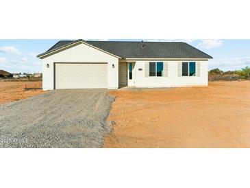 Charming single-story home featuring a two-car garage and neutral exterior, perfect for modern living at 18931 W Crescent Way, Buckeye, AZ 85326