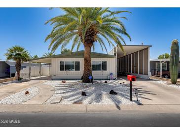 Charming single-story home with a lush palm tree in the front yard and a well-maintained exterior at 3307 E Kings Ave, Phoenix, AZ 85032
